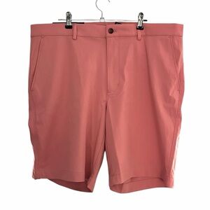 Greg Norman Men's Golf Performance Short
Size 36 - New With Tags - Color: Coral